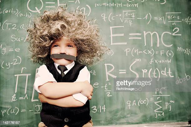 A young math whiz smiles as he has solved the riddles of the universe.